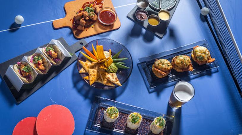 Kick back, drink up, chow down, or dance – it’s all fun and games at Slate NY. Photo by Paul Wagtouicz.